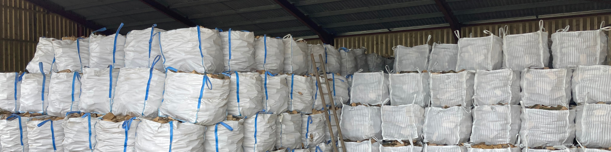 barn stored firewood logs